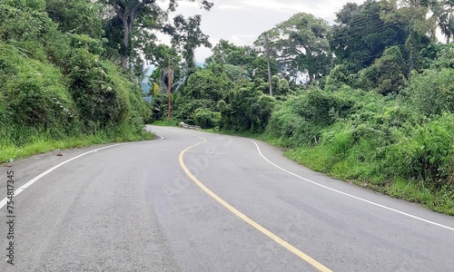 Beautiful curve asphalt road on the green mountain