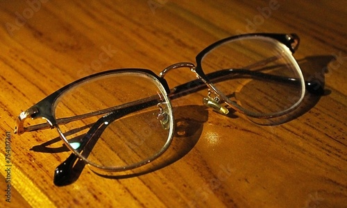 glasses on the wooden background close up. horizontal