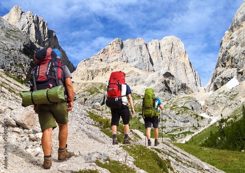 hikers and mount marmolada, Alps Dolomites mountains