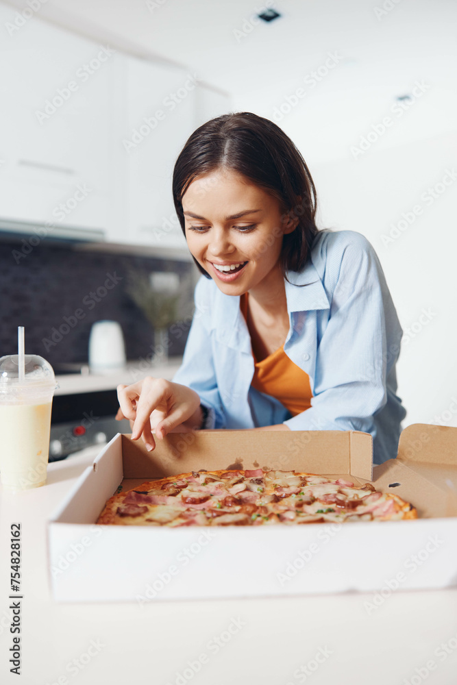 Woman enjoying pizza in a box with a glass of milk delicious and satisfying meal concept