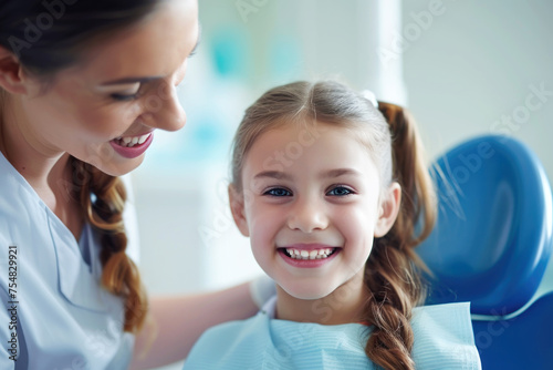 Kid girl examined by dentist in dental clinic, oral health concept