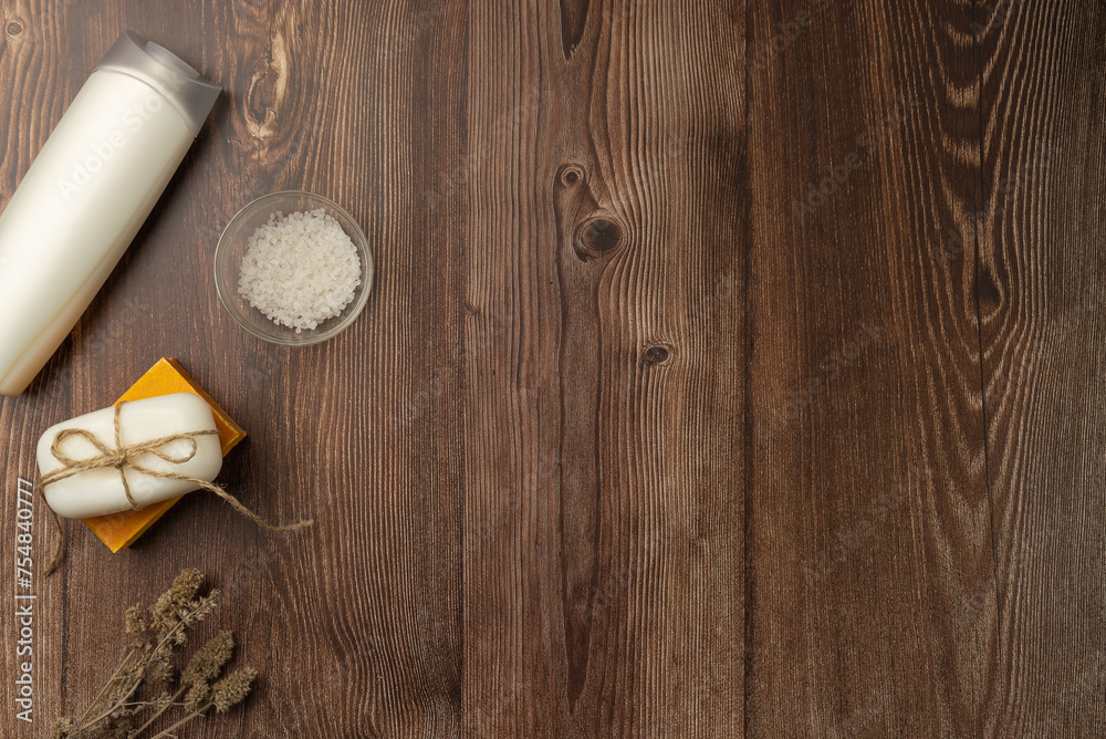 Composition with white bottle, soap and salt on wooden background. Composition with white bottle, soap and salt on wooden background.