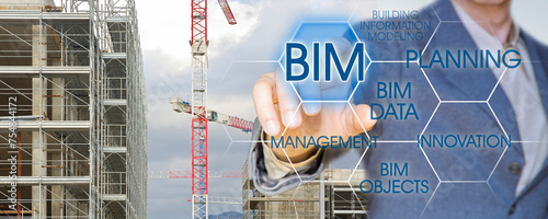 Building Information Modeling - BIM - A new way of architecture designing - Concept  with tower crane in a construction site photo