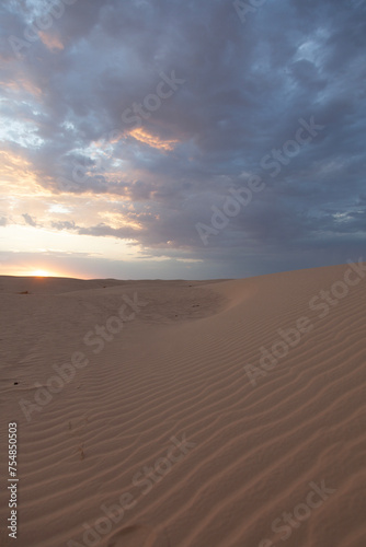 Sunset over the sand dunes in Sahara desert near Tozeur