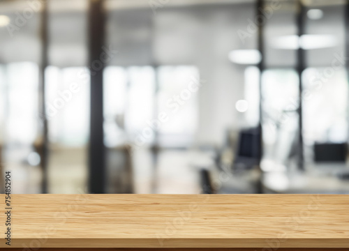 Wood table top and blurred office interior space