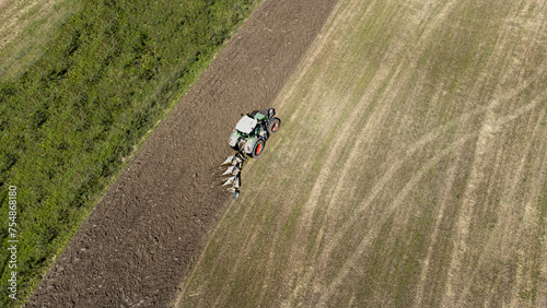Aerial view of a tractor preparing the field for planting.