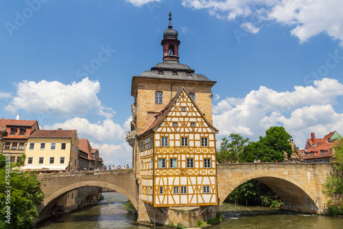 Old town hall with bell tower and bridges over river Regnitz in Bamberg, Upper Franconia, Bavaria, Germany