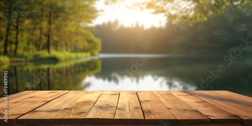 Wooden surface overlooking a peaceful lake and lush forest in warm sunlight.