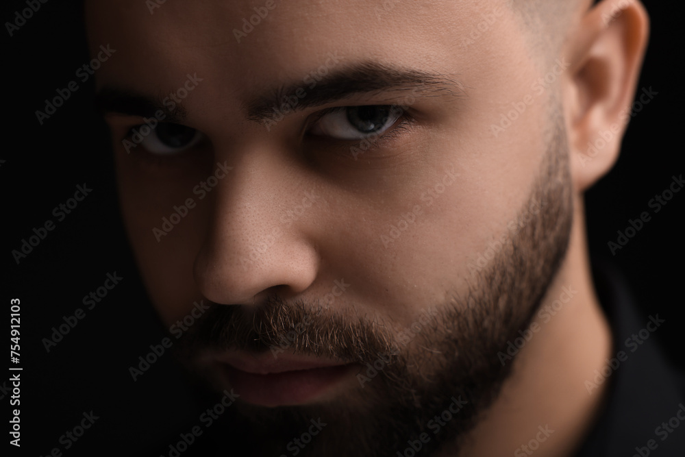 Obraz premium Evil eye. Man with scary eyes on black background
