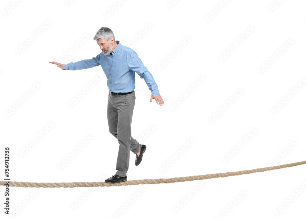 Risks and challenges of owning business. Man balancing on rope against white background Risks and challenges of owning business. Man balancing on rope against white background