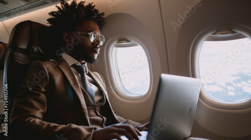 Young African American CEO Of A Private Company Using Laptop While Taking A Business Trip On A Private Plane. Generative AI