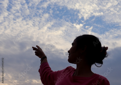 a girl watching on sky with sky view 