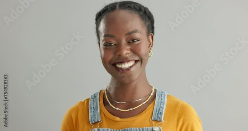 Face, smile and proud with black woman in studio on white background for cheerful satisfaction. Portrait, confident and carefree with happy young african model feeling joyful and positive closeup photo