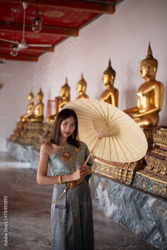 Beautiful woman in traditional dress costume,Asian woman wearing typical Thai dress identity culture of Thailand.	