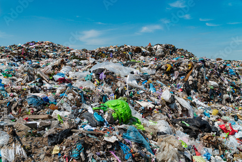 View of a large mountain of trash at a landfill. Municipal garbage landfill