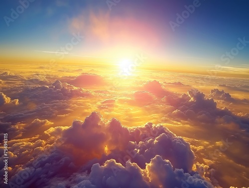 Captivating view from above the clouds at sunset, where the sun kisses the horizon, igniting the sky in hues of orange and gold.
