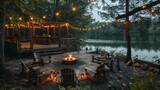A serene riverside outdoor setting with a glowing firepit, festive string lights, and wooden seating, perfect for tranquil evenings.