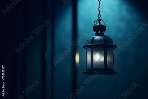 Arabic lantern with burning candles with copyspace on blue background. Ramadan Kareem greeting card © Canities