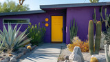 A modern craftsman cottage with a deep plum exterior and a bright yellow door. The landscaping features a modern rock garden with a variety of cacti along the concrete walkway.