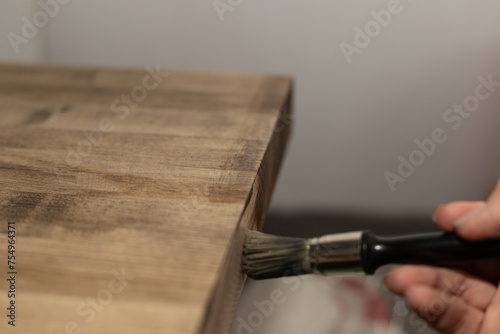 covering with a brush colored oil of a wooden ash shield