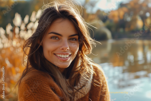 woman who exudes happiness and a sense of feeling truly alive in a beautiful natural park near a lake