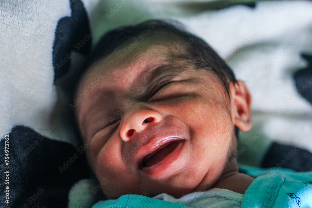 Cute newborn baby sleeps with cute expression. Asian newborn baby sleeping. life concept.
