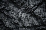 Dark Aged Shabby Cliff Face And Divided By Huge Cracks And Layers. Coarse, Rough Gray Stone Or Rock Texture Of Mountains, Background And Copy Space For Text On Theme Geology And Mountaineering.
