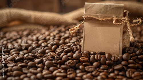 An arrangement of roasted coffee beans surrounds a brown paper bag with a blank label  ready for branding and commerce