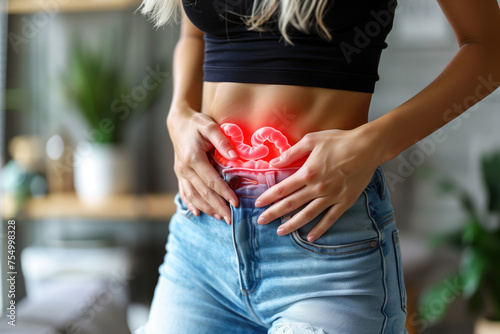 Stomach ulcer, woman with abdominal pain suffering on a gray background, symptoms of gastritis, diseases of the digestive system, health problems concept © staras