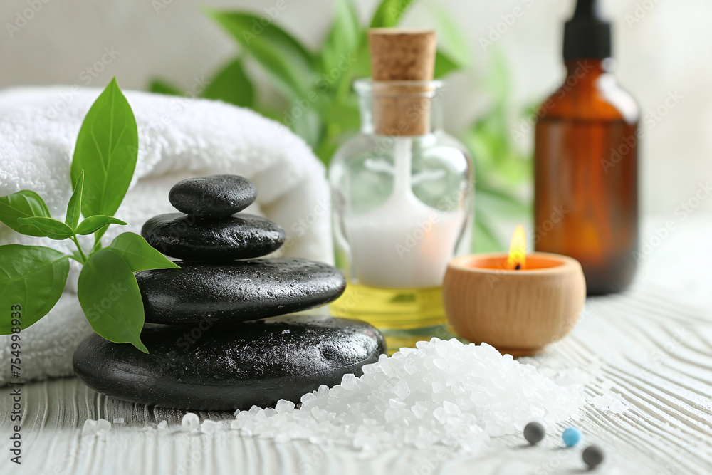 Beauty treatment items for spa procedures, massage stones, aromatic candles essential oils and sea salt, Zen atmosphere with copy space for text or logo