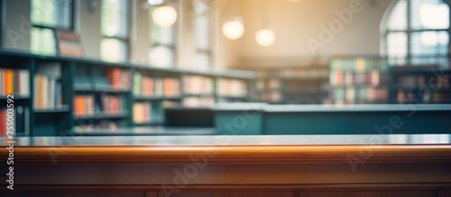 A blurred image showing a bookshelf in a library. The background is out of focus, giving prominence to the rows of books on the shelves. © Lasvu