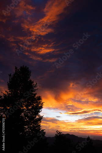 Beautiful Colorful Cloudy Sunrise Over Mountains in Boulder, Colorado © Jenna