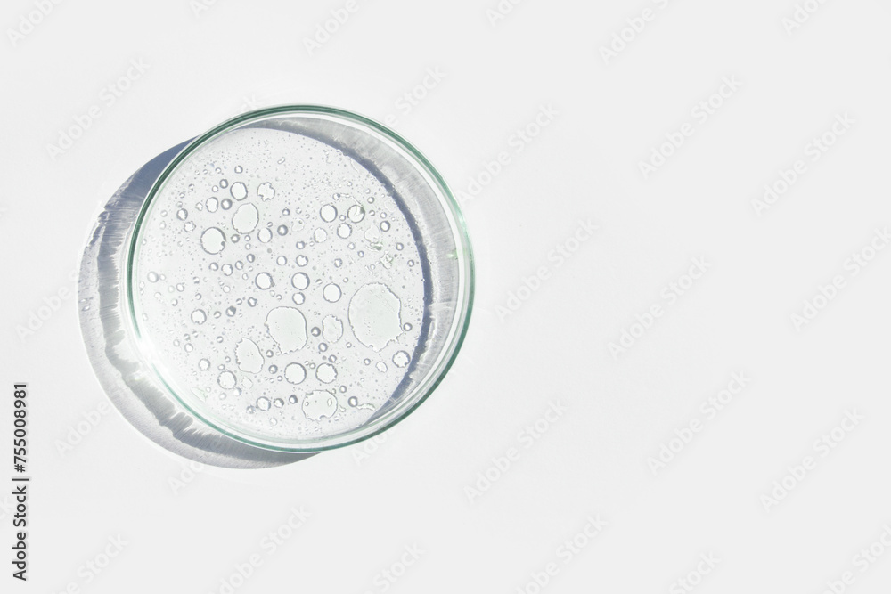 Petri dish. Petri cups with liquid. Kit. Chemical elements, oil, cosmetics. Gel, water, molecules, viruses. Close-up. On a white background. Petri dish. Petri cups with liquid. Kit. Chemical elements, oil, cosmetics. Gel, water, molecules, viruses. Close-up. On a white background.