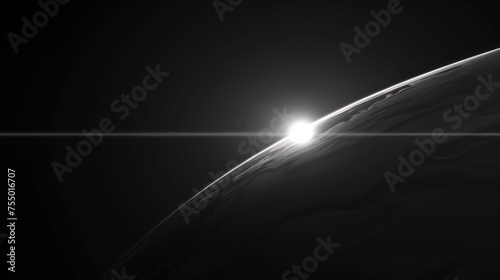 a black and white photo of the sun shining over the horizon of a distant object in the dark night sky. photo