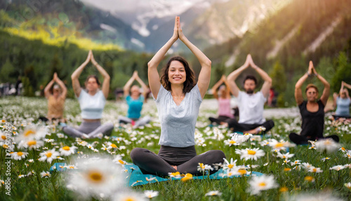 summerdays yoga workshop where a group of people are doing yoga on a grass photo