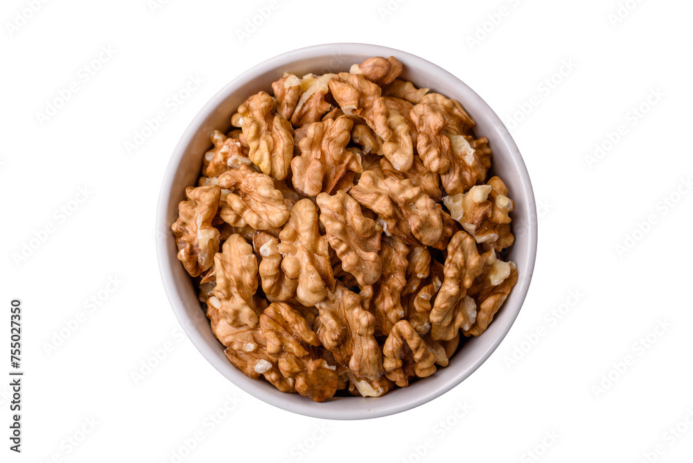 Delicious fresh peeled raw walnuts in a ceramic plate Delicious fresh peeled raw walnuts in a ceramic plate