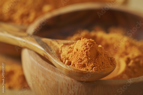 Pure Turmeric Powder in Wooden Spoon and Bowl, Natural Organic Ingredient for Healthy Eating and Diets