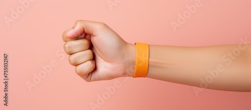 Stylish Arm Accessory: Close-up View of Hand with Sporty Wrist Band in Vibrant Blue Color