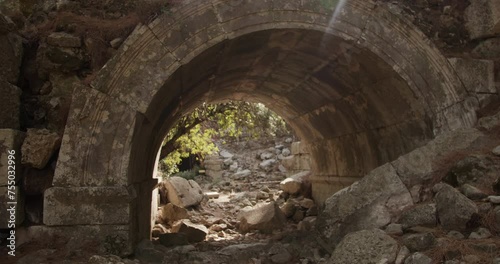 Ancient ruins on a hill in a forested landscape. Ruins of Olympus city in ancient Lycia photo
