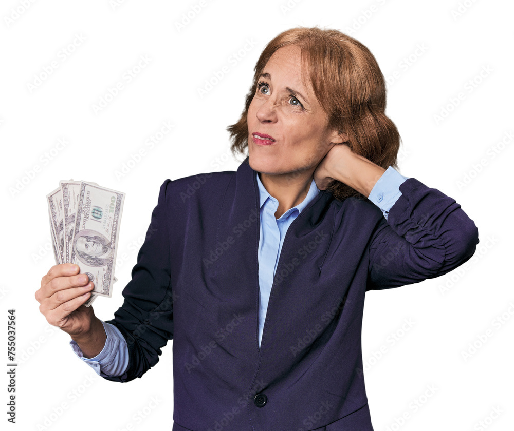 Mid-aged Caucasian with dollars in studio touching back of head, thinking and making a choice. Mid-aged Caucasian with dollars in studio touching back of head, thinking and making a choice.