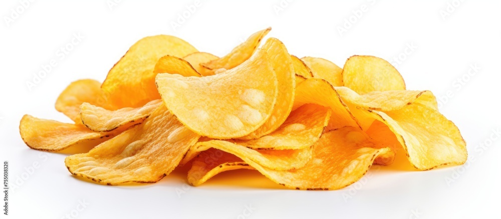A pile of potato chips, a popular snack food, is displayed on a white background. These crispy chips can be enjoyed as a staple food or as a side dish with various cuisines A pile of potato chips, a popular snack food, is displayed on a white background. These crispy chips can be enjoyed as a staple food or as a side dish with various cuisines
