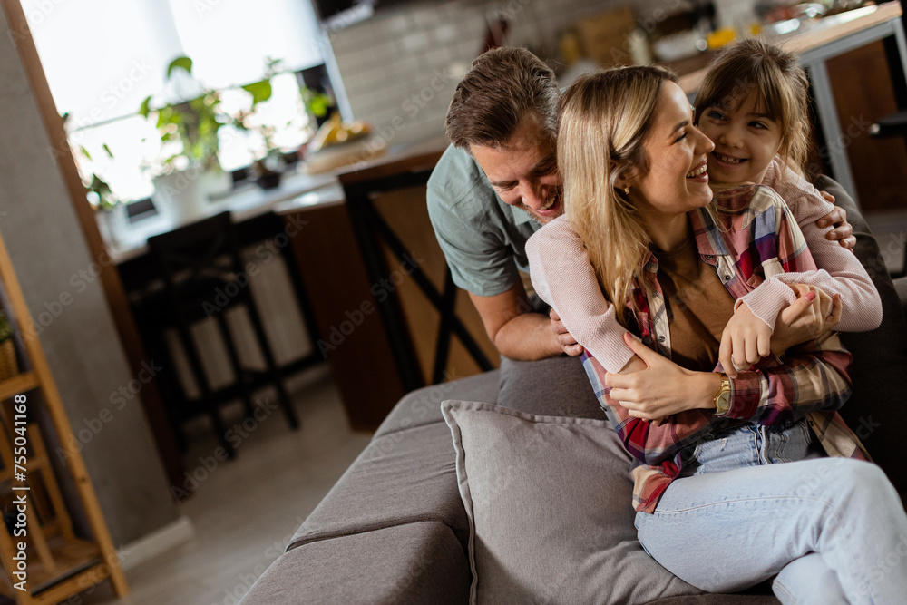 Fototapeta premium Cozy family bonding moment in a warm living room