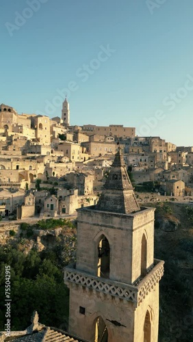 Matera Basilicata Vertical - Sunset Aerial View by Drone 4K around the Old Town Cathedral and Church - in the Sassi di Matera - epic journey