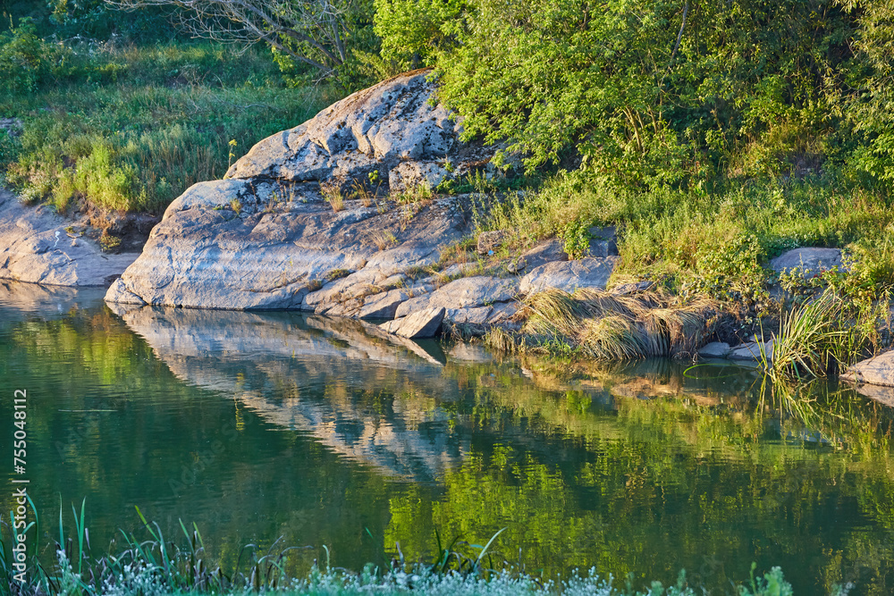 Enjoy the tranquil beauty of a river at dawn with this stunning ...