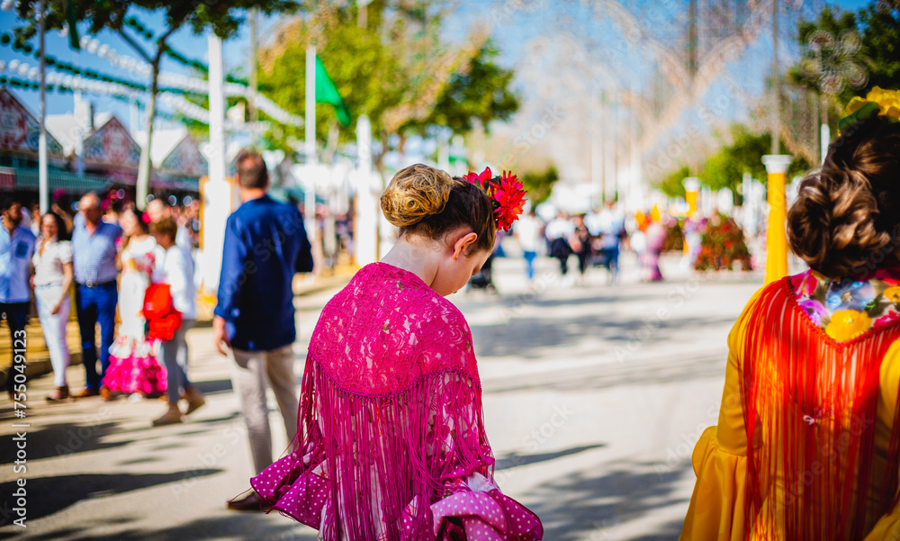 woman in a sevillana costume in a traditional festival in Rota Andalusia