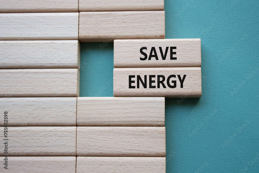 Save Energy symbol. Wooden blocks with words Save Energy. Beautiful grey green background. Business and Save Energy concept. Copy space. Save Energy symbol. Wooden blocks with words Save Energy. Beautiful grey green background. Business and Save Energy concept. Copy space.