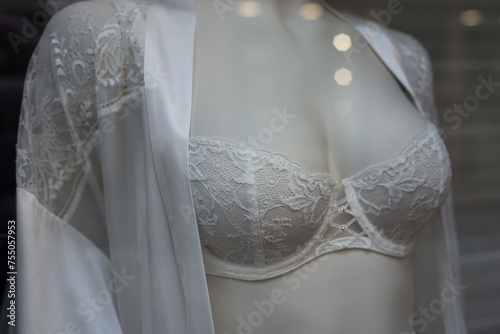 Closeup of white bra on mannequin in a fashion store showroom