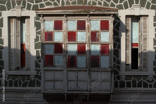 Oriel Window With Red And White Colors photo