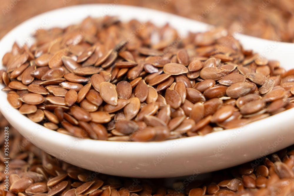 Flax seeds in a spoon macro Flax seeds in a spoon macro