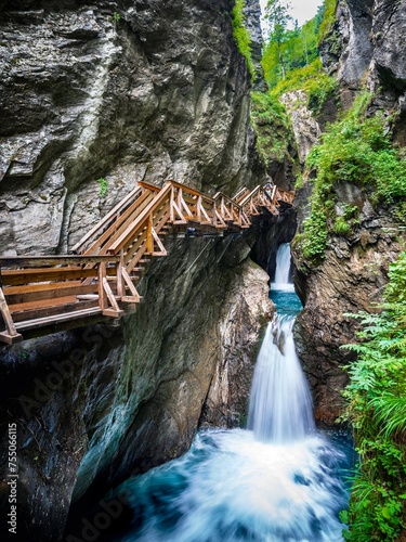 Tour durch die Sigmund Thun Klamm bei Kaprun (Österreich) Die Schlucht ist über extra angefertigte Holzwege und Brücken über dem reißenden Fluss begehbar. photo